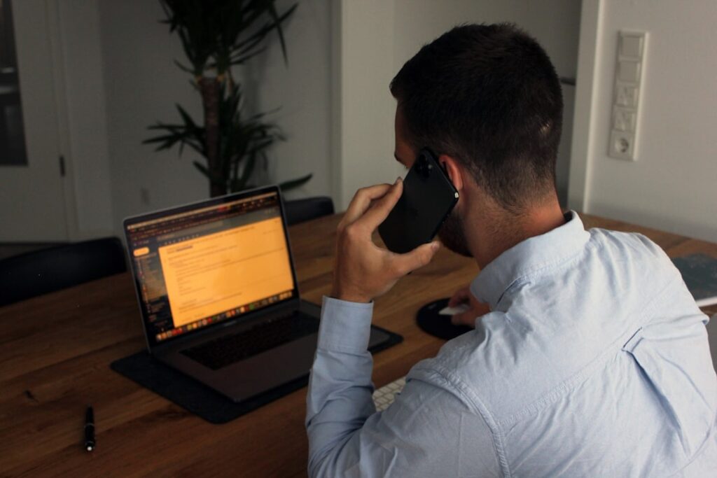 a business man who has a phone call with a client